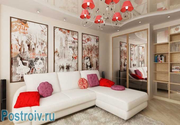 Угловой диван в интерьере гостиной с модульными картинами