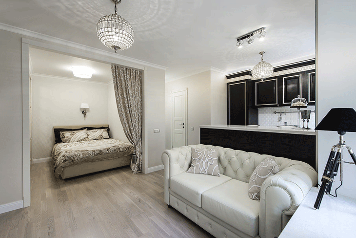 Отдельное спальное место в квартире студии, сделанное из гипсокартона - Фото