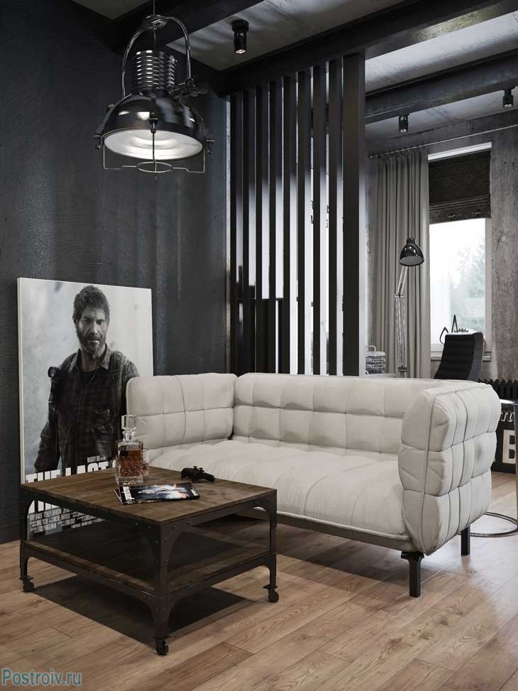 Белый диван в черном интерьере комнаты. Фото