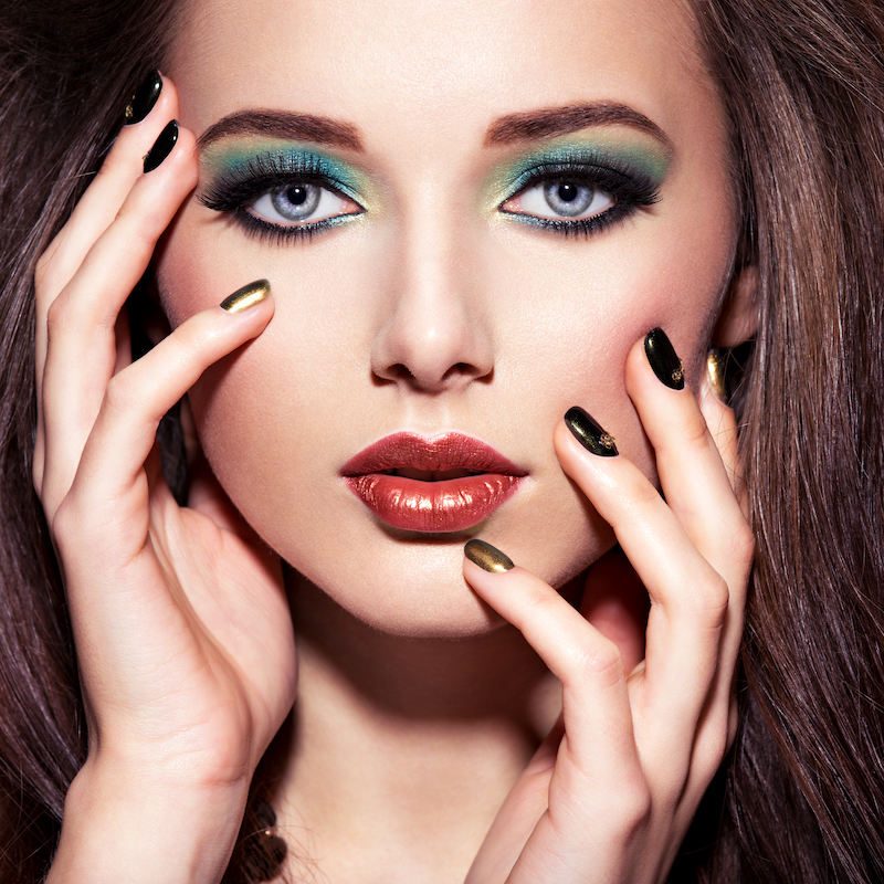 beautiul-woman-with-green-make-up-and-creative-color-of-nails